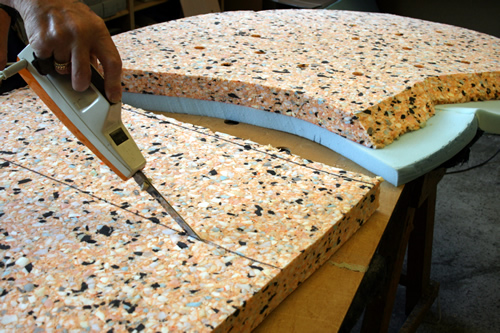 upholstery cutting the foam,